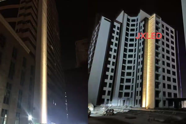 Diagram showing light from a narrow beam reaching the top of a skyscraper